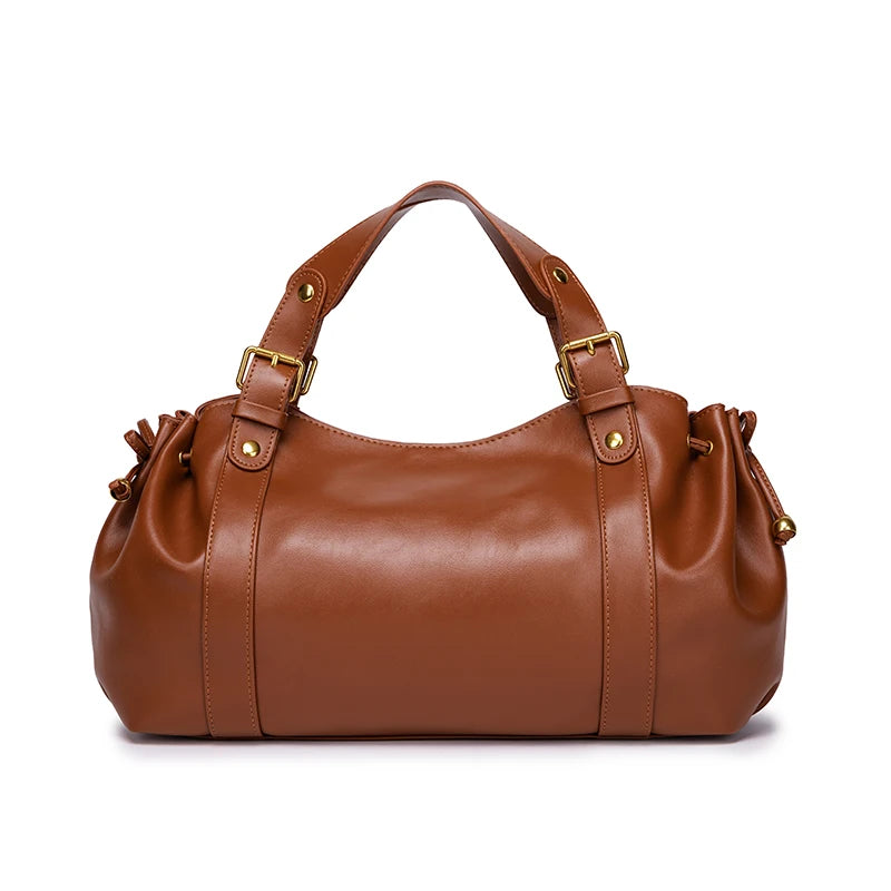 Sac Boston pour femme (collection 2026) – Sac à main souple et épuré de couleur unie, idéal pour le travail, porté épaule ou croisé.