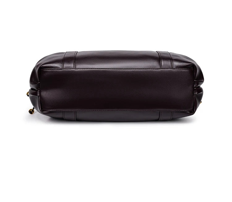 Sac Boston pour femme (collection 2026) – Sac à main souple et épuré de couleur unie, idéal pour le travail, porté épaule ou croisé.