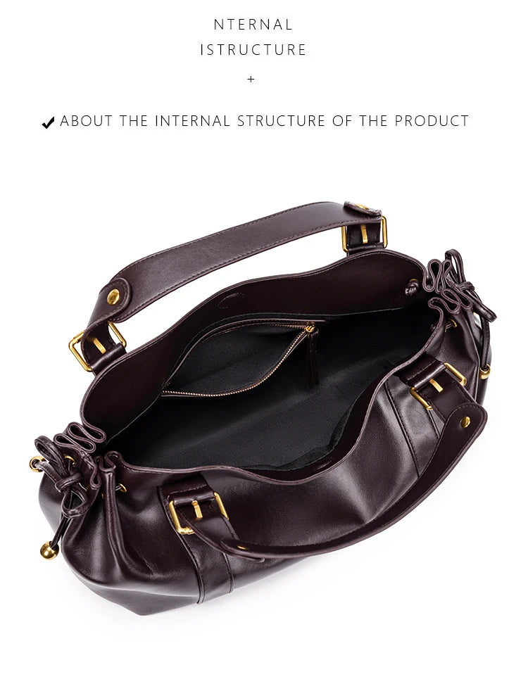 Sac Boston pour femme (collection 2026) – Sac à main souple et épuré de couleur unie, idéal pour le travail, porté épaule ou croisé.