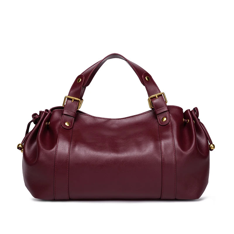 Sac Boston pour femme (collection 2026) – Sac à main souple et épuré de couleur unie, idéal pour le travail, porté épaule ou croisé.
