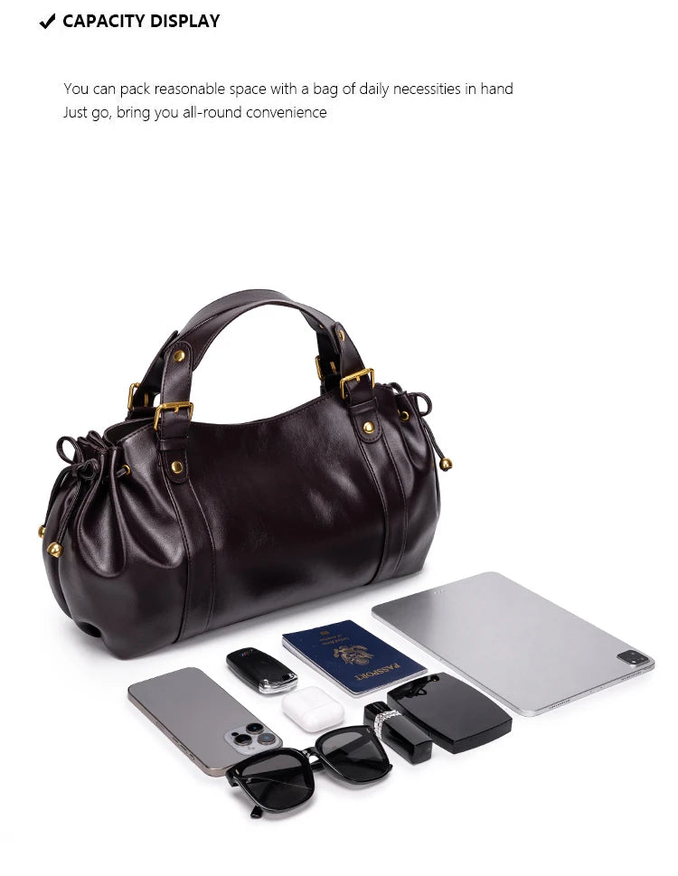 Sac Boston pour femme (collection 2026) – Sac à main souple et épuré de couleur unie, idéal pour le travail, porté épaule ou croisé.