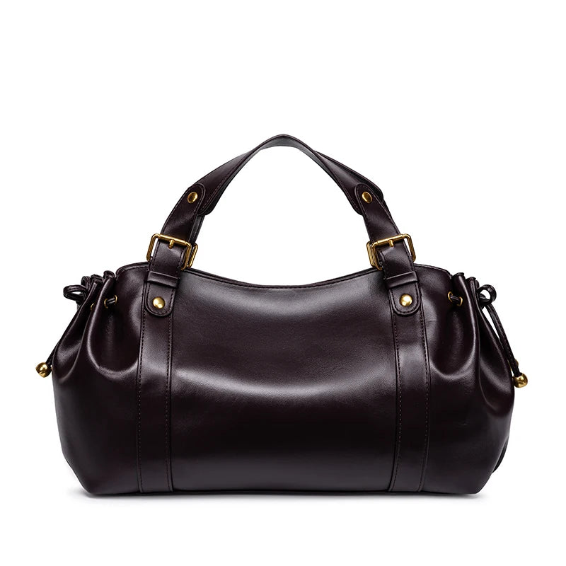 Sac Boston pour femme (collection 2026) – Sac à main souple et épuré de couleur unie, idéal pour le travail, porté épaule ou croisé.